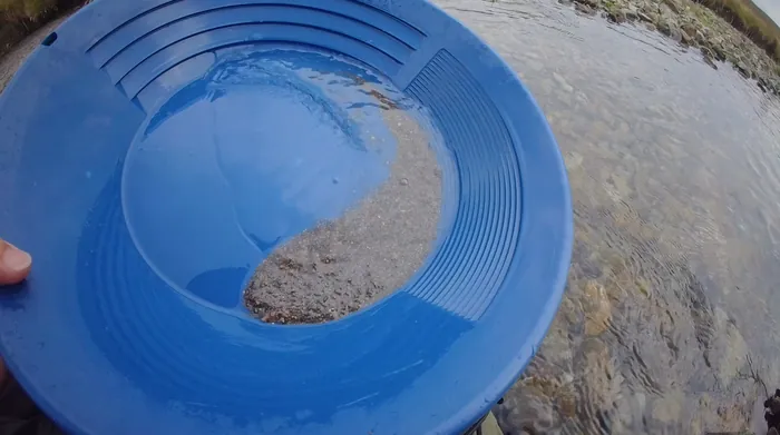 Panning gravel down in a Lowther Hills burn, southern Scotland